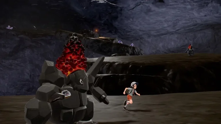 Pokemon Scarlet Switch NSP Trainer runs from a large rock-type Pokémon with glowing red coal on its head inside a dark cave.